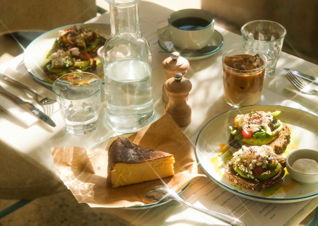 A wide variety of breakfast foods and beverages.