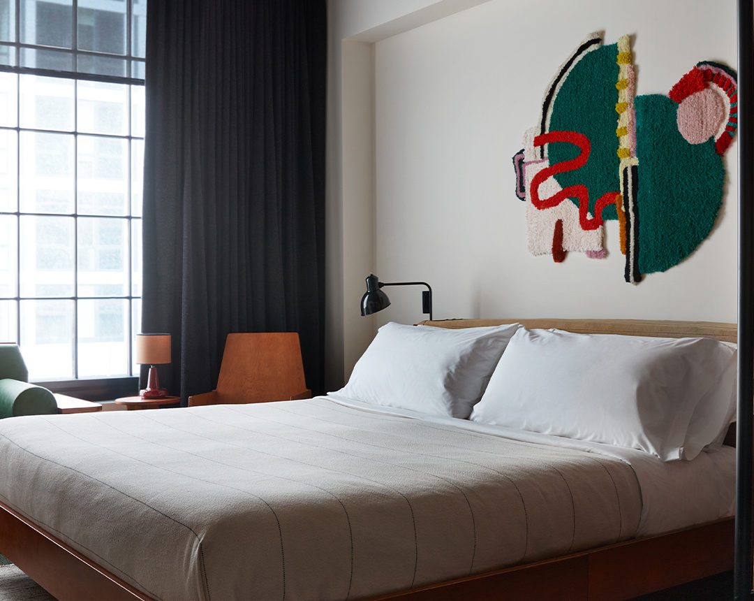 A room with multiple seating options, natural light, and additional lamps