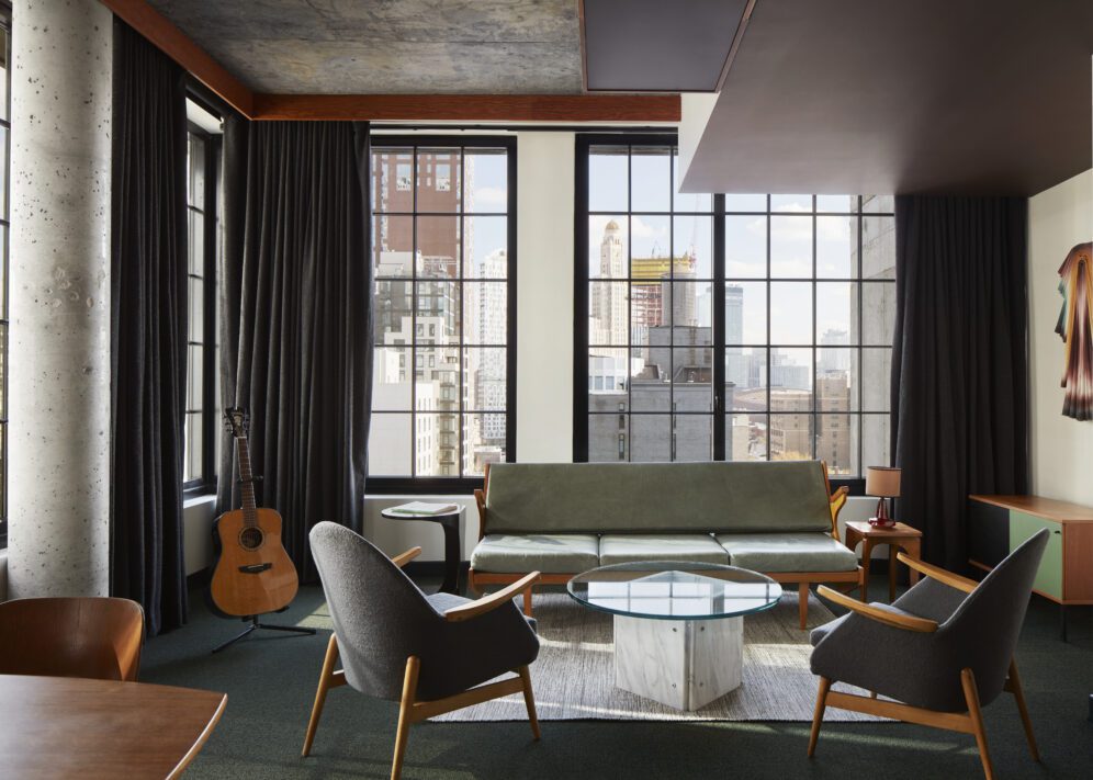 ace suite ace hotel brooklyn a living room with a guitar and large windows
