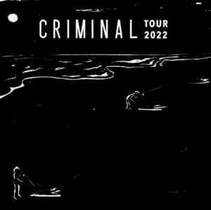 A black sign that says Criminal Tour 2022.