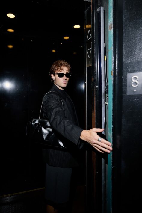NYC Fashion Week - man holding a door open