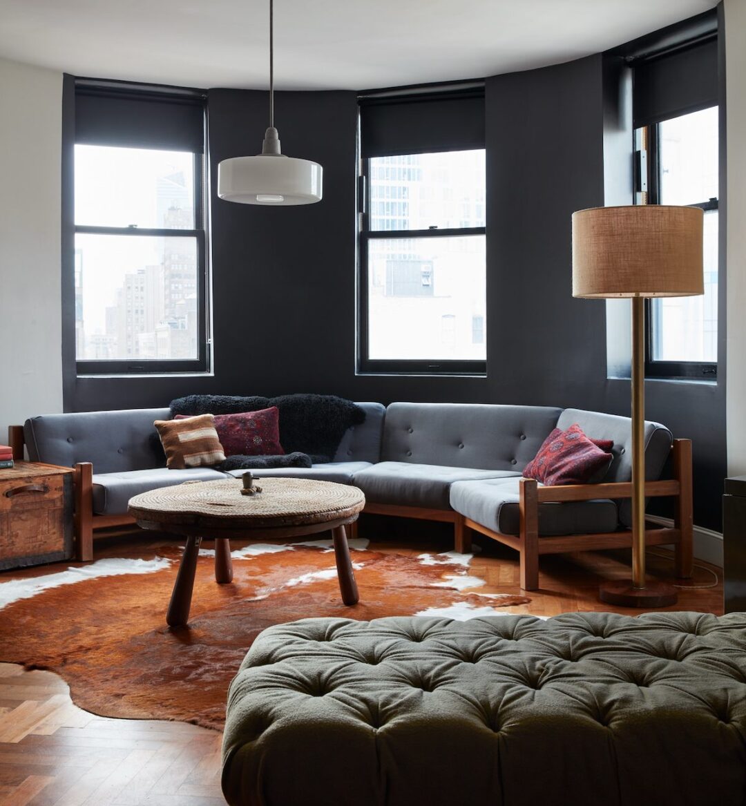 Guest room with sofa seating for a group at Ace Hotel New York