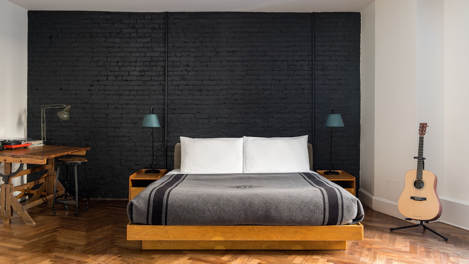 Loft Suite at Ace Hotel New York with exposed brick and hardwood floors
