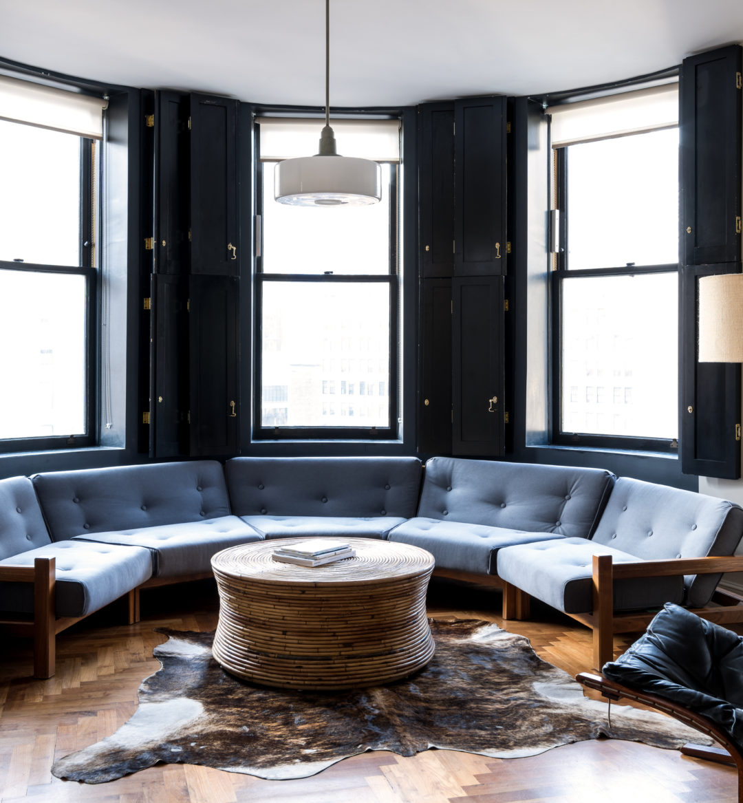 Loft seating area with Midtown Manhattan views at Ace Hotel New York