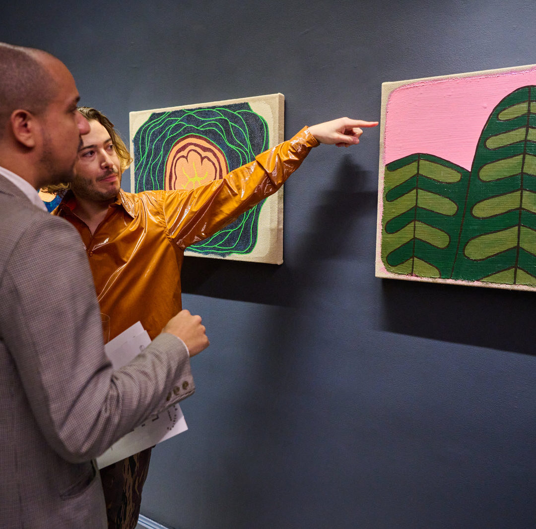 Guests viewing artwork at an art event at Ace Hotel New York