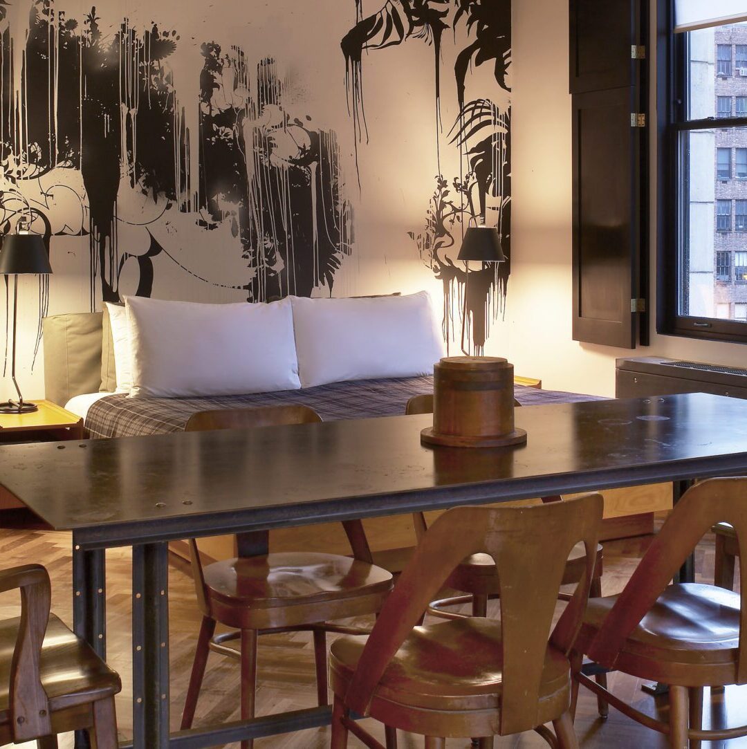 Event room with a long table set up for a gathering at Ace Hotel New York