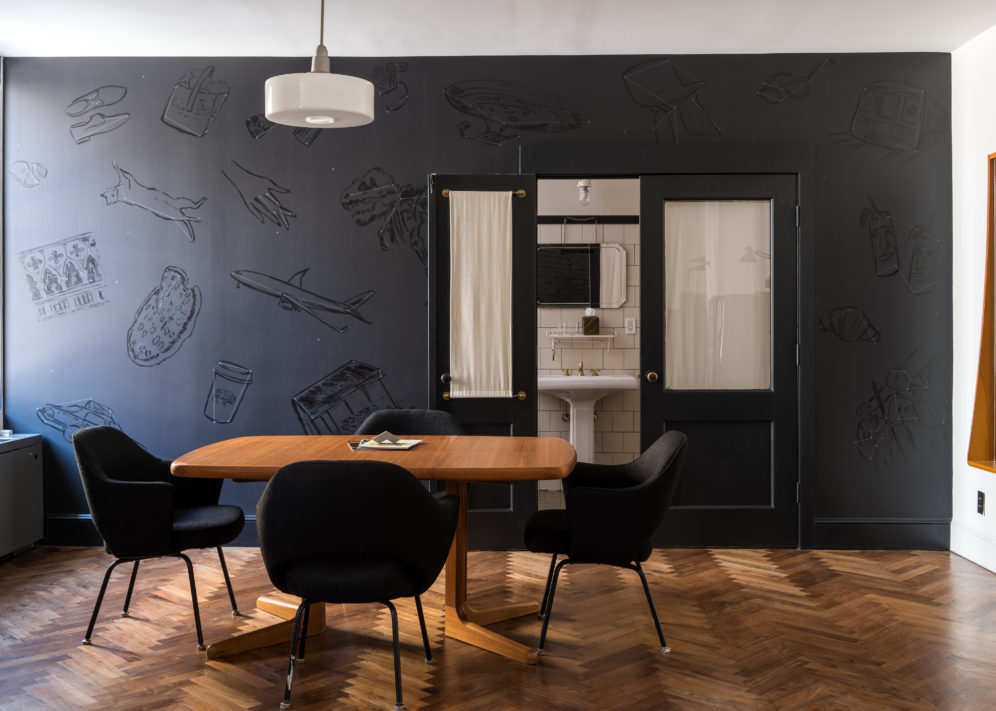 Loft Suite at Ace Hotel New York with table and additional seating