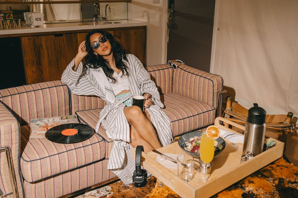 A woman sitting and relaxing on a couch