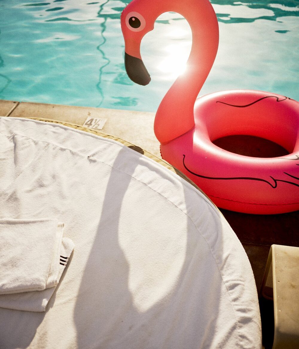 Palm Springs - poolside with flamingo pool float