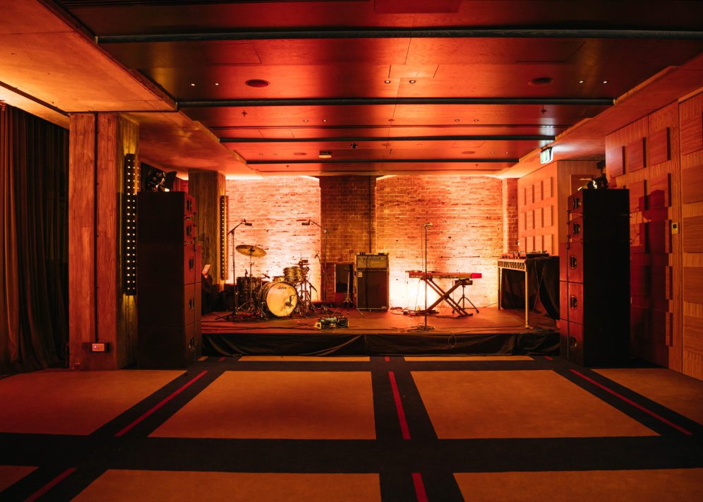 meeting space with band equipment on stage