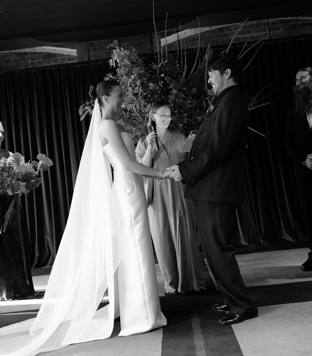 Bride and Groom holding hands at their wedding