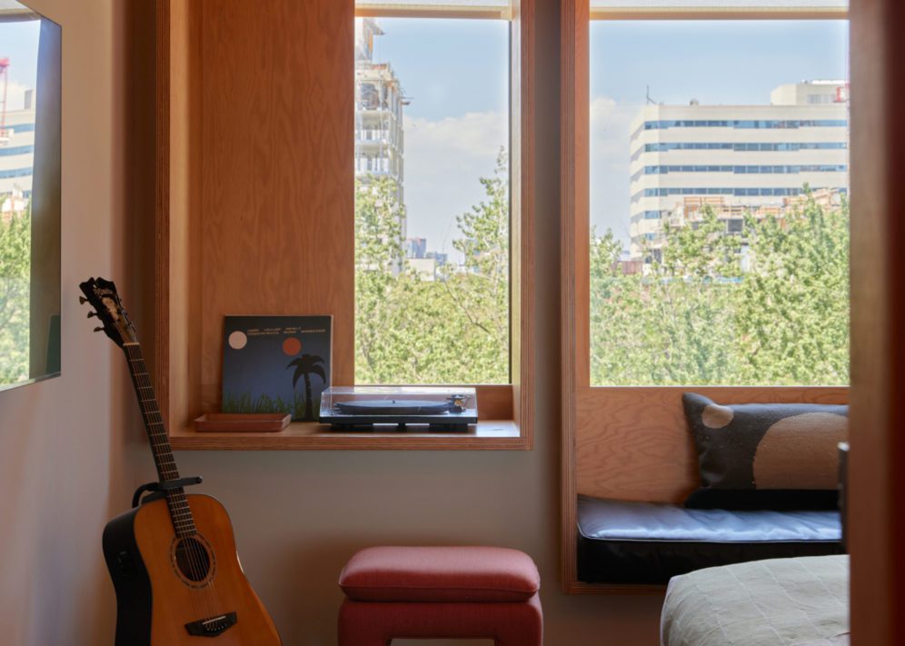Room with guitar and turntable