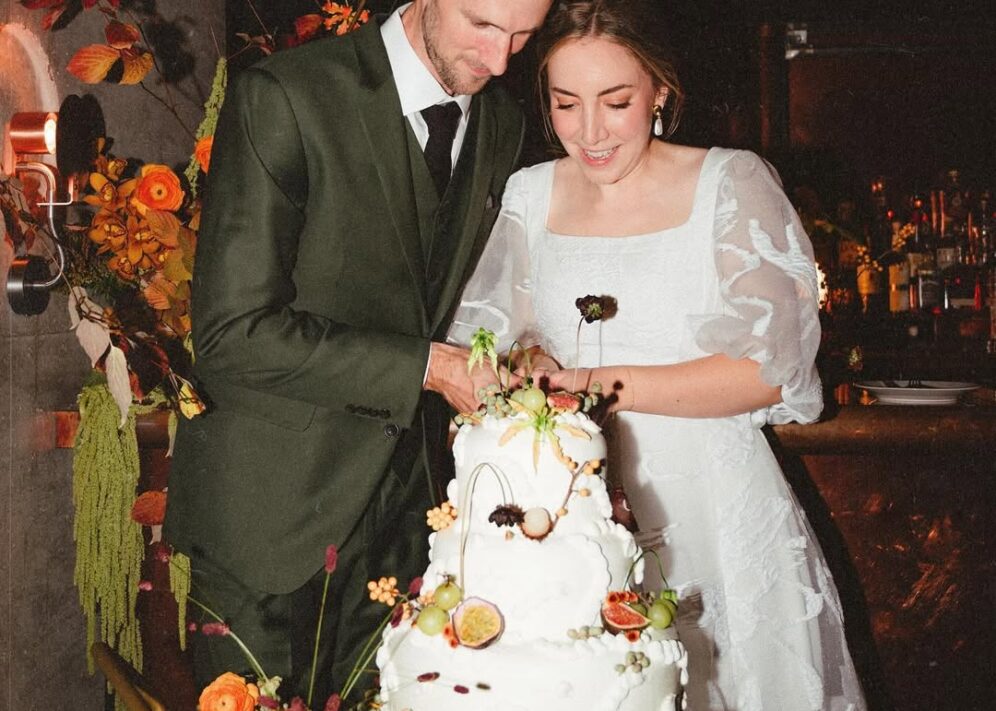 Alder - bride and groom cutting their wedding cake