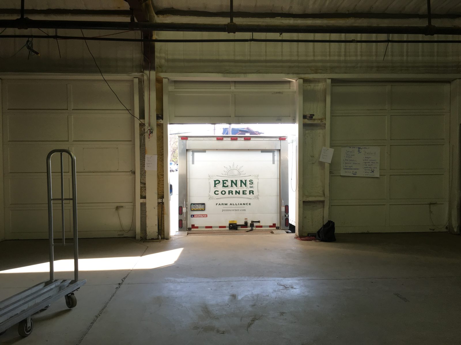 food delivery truck backing into garage