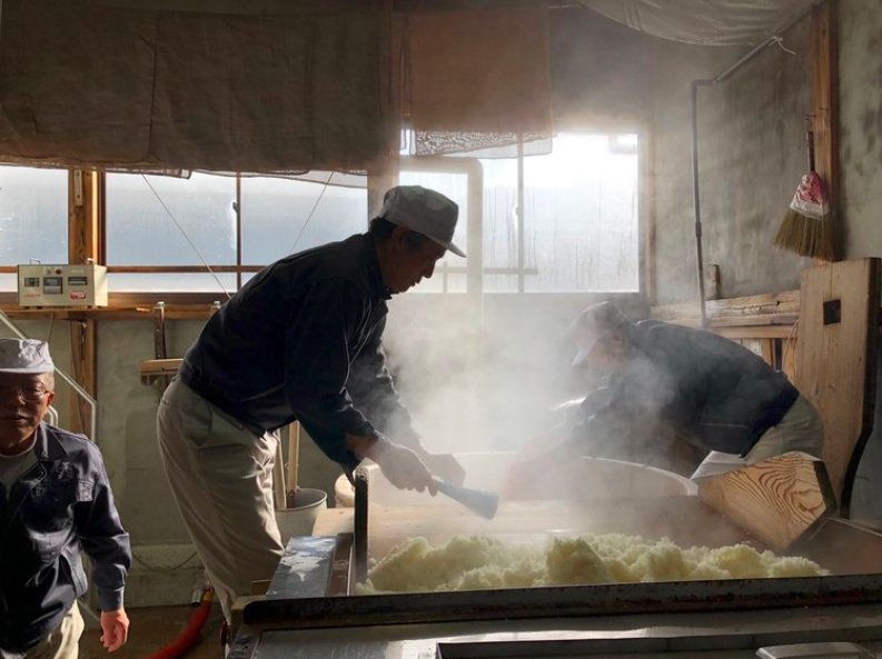 person cooking rice