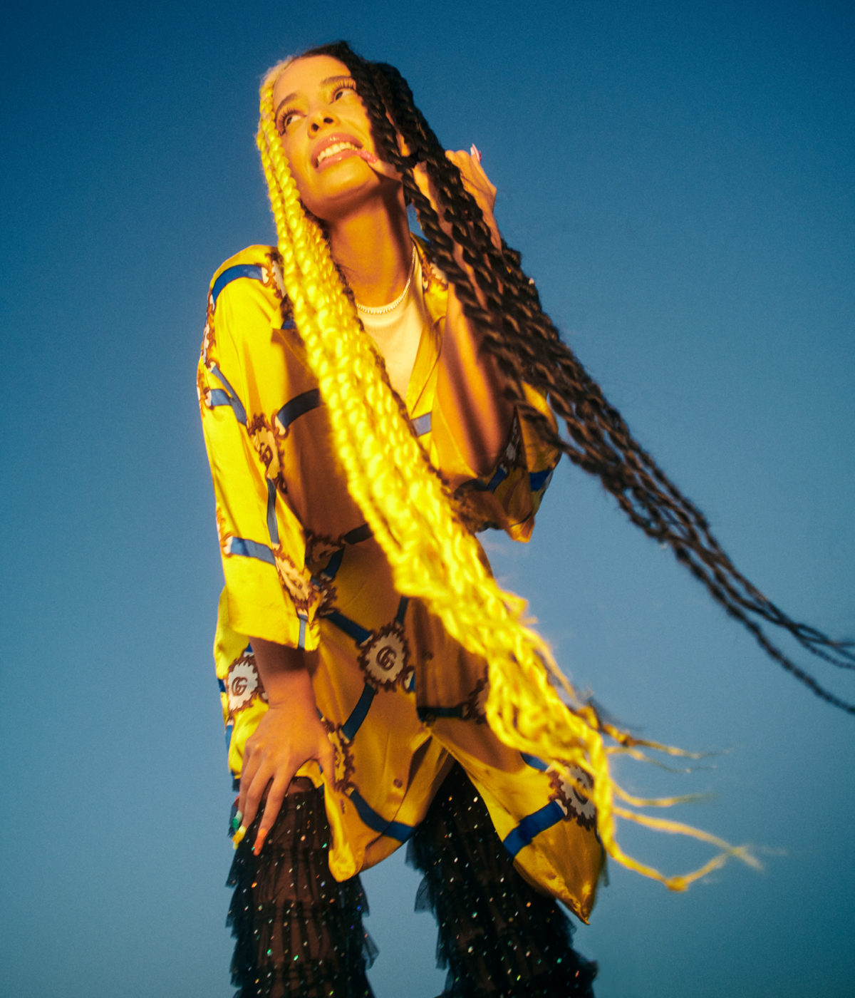 person with long yellow and black dreads