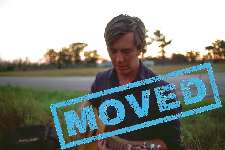 the word Moved stamped on a photo of Bill Callahan holding a guitar