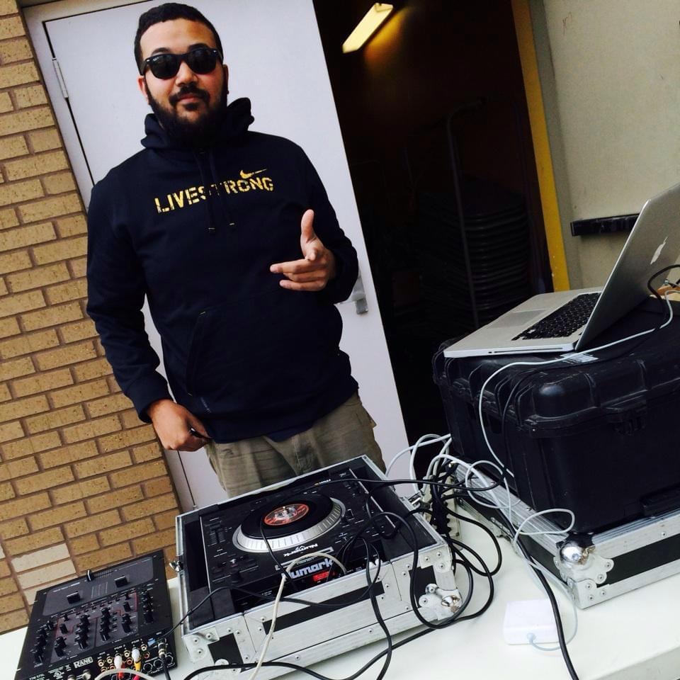 DJ in front of equipment