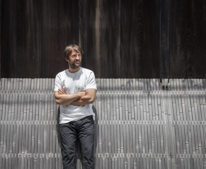 person standing against wall