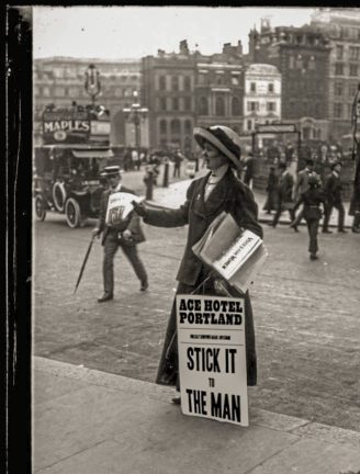 black and white image of woman with protest sign